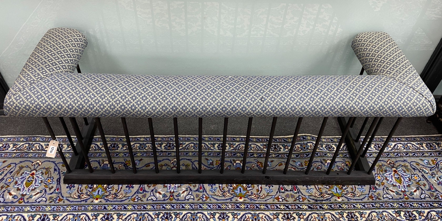 An early 20th century cast iron club fender, (re-painted and re-upholstered) length 164cm, depth 52cm, height 58cm